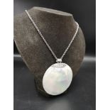 Large silver stunning mother of pearl pendant with silver mount on a silver 925 belcher chain.