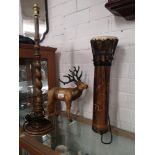 Barley twist table lamp, stag figure together with African drum..