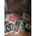 Large shelf of vintage 1900s pictures, post cards etc.