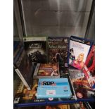 Shelf of PlayStation 2 games etc.