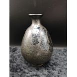 Oriental bottled necked vase with grey and black pattern signed to the base.