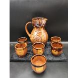 Retro tin glazed stone ware jug with matching goblets.