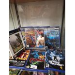 Shelf of PlayStation 2 games.