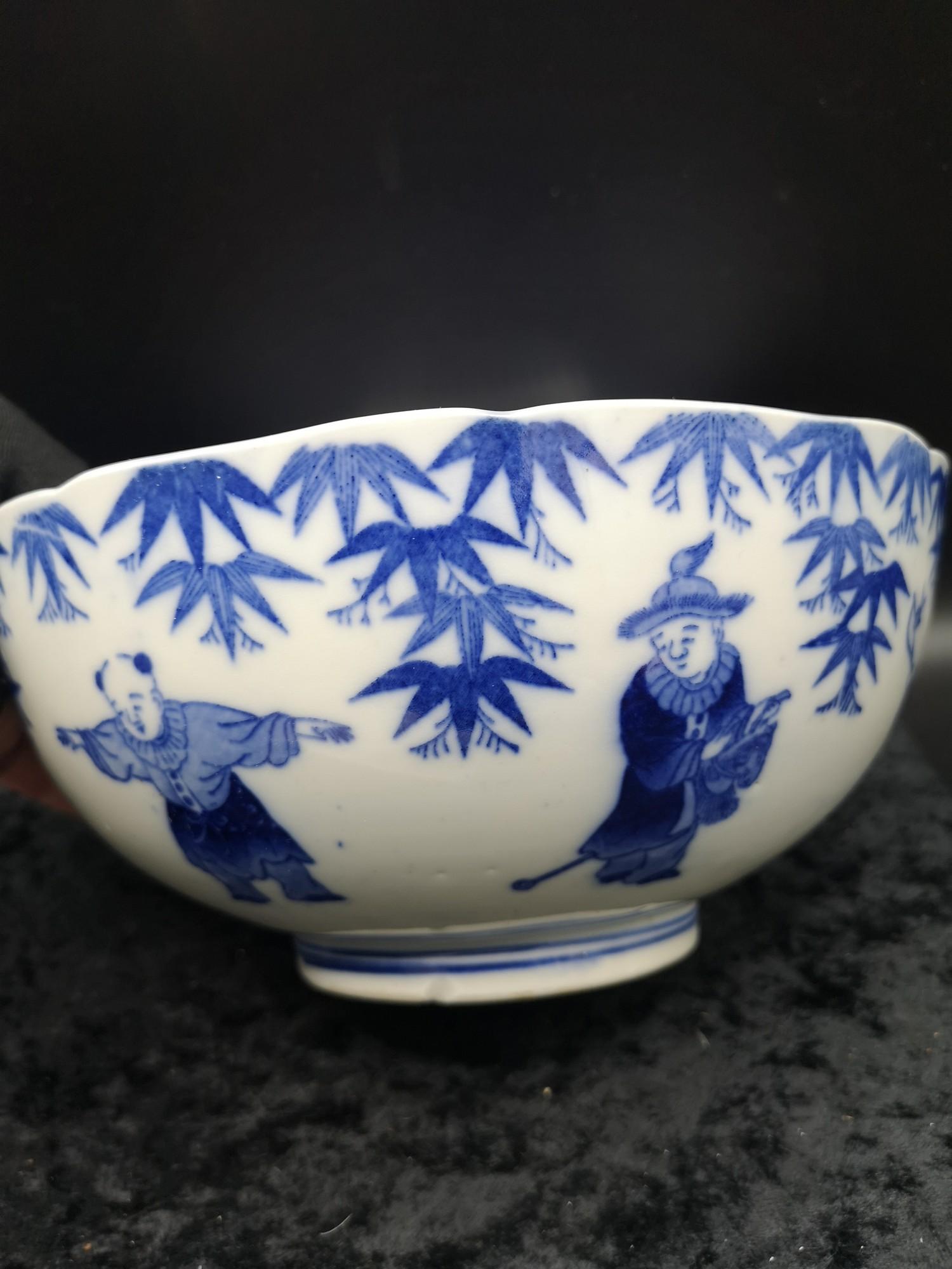 Chinese bowl depicting gathering in blue and white form with character bstanp to base. As found. - Image 2 of 3