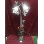 Bronze effect figural table lamp with shading.