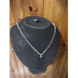 Silver belchar chain set with black stone setting together matching silver ring.