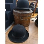 Antique metal hat box together with 2 bowler hats.