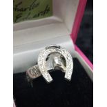 Heavy silver 925 horse shoe ring with horse head.