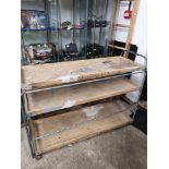 Large retro bread carrier trolley with advertising wooden trays And named caster feet.