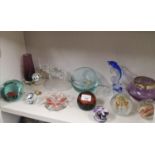 Shelf of Paperweights and art glass.