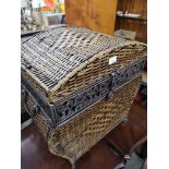 Modern contemporary freestanding linen basket chest with metal bounding.