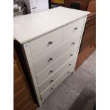 White 2 over 4 chest of drawers.