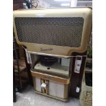 Large retro 1960s wall mounted jukebox with records does light up.