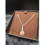 Silver necklace in Amber setting.