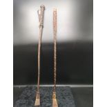 2 vintage riding crops.