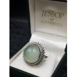 Silver 925 ring set in pale green stone.