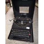 Remington type writer in fitted case.