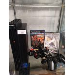 Playstation 2 console with 2 games and controller .