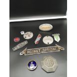 Collection of vintage car badges.