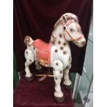 Old large tin plate child's ride on horse.