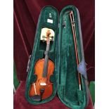 Violin with bow in fitted case.