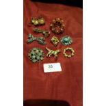 Selection of costume brooches.