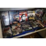 Shelf of playstation 2 games .