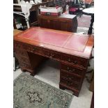 Reproduction leather topped double pedistal knee hole desk.