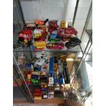 3 Shelves of playworn cars .