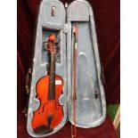 Violin with bow in fitted case with label.