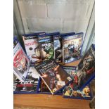 Shelf of playstation 2 games.