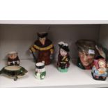 Shelf Of Toby jug includes charter jug , doulton ,burleigh ware , Crown clarence etc .