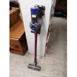 Dyson slim hoover with charger.