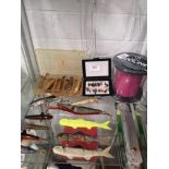 Shelf of fishing lures etc .