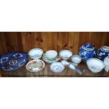 Shelf of chinese wares to include blue and white chinese plate .