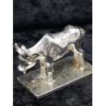 White metal cow figure with marking to base.