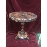 Arts n crafts pedistal table in carved design.