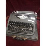 Vintage Oliver courier typewriter with casing.