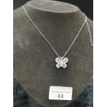 Silver necklace set in butterfly pendant .