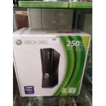 Boxed xbox 360 console .