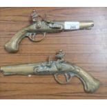 Pair of brass pistol plaques.