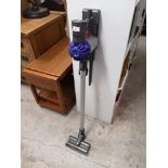 Dyson slim hoover with charger.