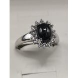 Stunning silver ring set with black and clear stones.