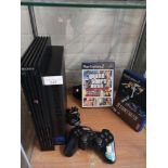 Playstation 2 console with 2 games and controller .