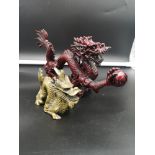 2 Oriental dragon figures.