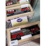 2 Boxed corgi fire engines .