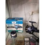 Boxed shakespear zen fishing reel with line .