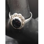 Silver marcasite and black effect ring.