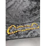 Set of Amber style beads. Has damage to grey end.