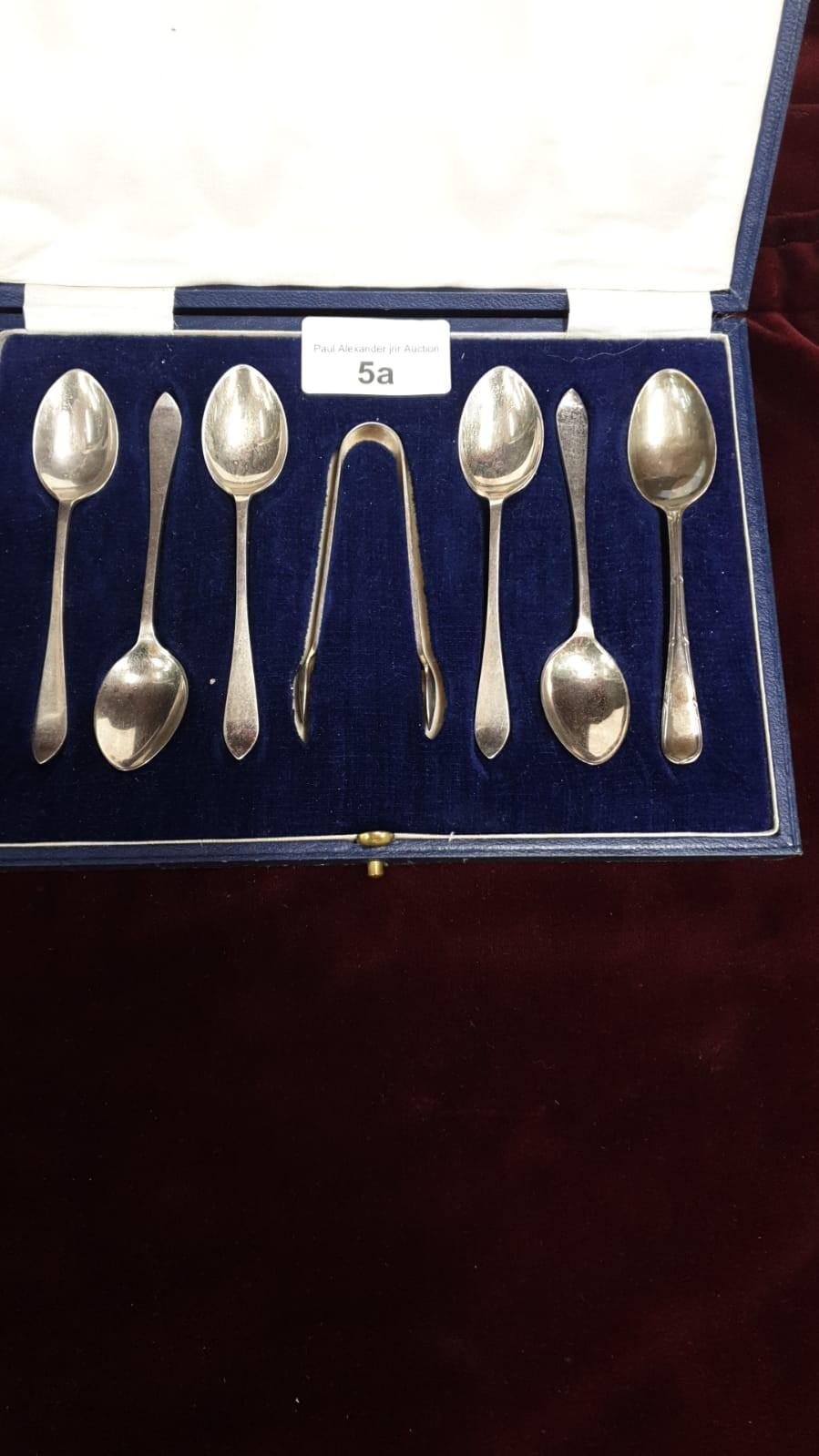 5 silver Hall marked sheffield spoons and matching tongs together with silver Hall marked spoon.